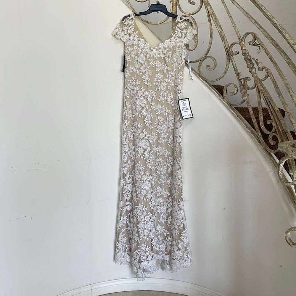 Tadashi shohi gown size 8. Never worn still has tags. Color is ivory and natural